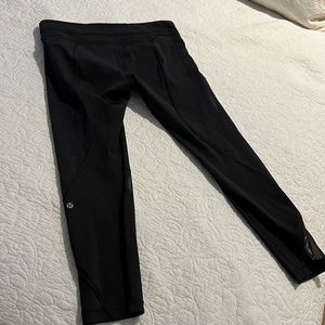 Lululemon leggings with zipper pockets and detail at calf